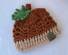 Keep your precious little one toasty warm and looking sharp this fall with this cozy Acorn Beanie.  It is lovingly crocheted in a highly textured stitch that is sure to make a fashion statement for your next outing or photo opportunity.   This adorably cozy beanie would make a wonderful gift for a baby shower or just because that sweet baby you know needs something special to wear this fall season. Made from easy-care 100% cotton yarn that is deliciously soft and smooth it is perfect for baby's Cute Brown Hat For Fall, Fall Beanie Bonnet In Acrylic, Crochet Acorn Baby Hat, Woodland Crochet Baby Hat, Pumpkin Beanie, Fall Hand-knitted Bonnet, One Size, Newborn Beanie, Baby Head, Fall Baby