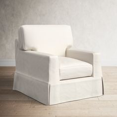 a white chair sitting on top of a hard wood floor