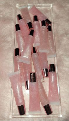 Welcome to the world  Ms. MAGIC GLOSS  This gloss here is called Champagne sugar 🥂💖 You can wear it over your lipstick or just by itself!  It has a beautiful, and delicious strawberry scent! You will never want to run out!  This product here is a beautiful 15ml squeeze tube with a metallic pink cap! 💗 She is smooth and has a beautiful glow! If you want a more natural look, I suggest to purchase the wand tube. If you want to pack down the sparkle then I recommend the squeeze tube! 💗💙 This Ma Sparkly Lip Gloss, Tube Lip Gloss, Lip Gloss Pink, Strawberry Scent, Vegan Lip Gloss, Lip Gloss Cosmetics, Best Lip Gloss, Lip Gloss Collection, Pink Lip Gloss