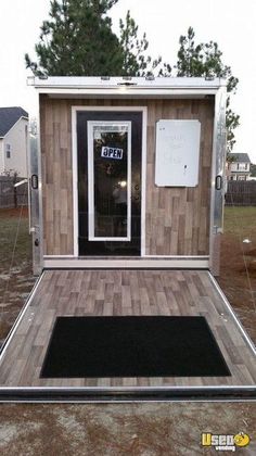 a small house made out of wood and metal