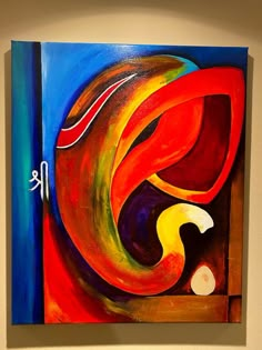 an abstract painting is displayed on the wall