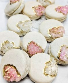 some white and pink cookies with gold flecks