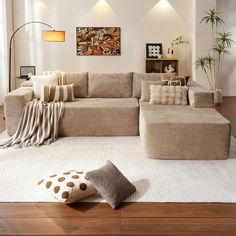 a living room filled with lots of furniture on top of a hard wood floored floor