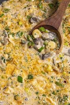 a skillet filled with food and a wooden spoon