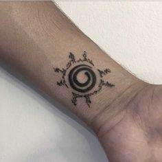 a person's arm with a tattoo on it and an arrow in the middle