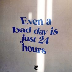 a sign that says even a bad day is just 24 hours