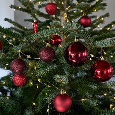 a christmas tree with red and gold ornaments