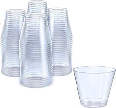 a stack of clear cups sitting next to each other