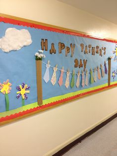 a happy father's day bulletin board on the wall