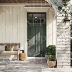 a green front door on a white brick house