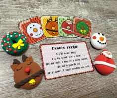 a wooden table topped with magnets and christmas decorations