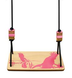 a wooden swing with pink and black handles