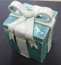 a blue and white box with a bow on it