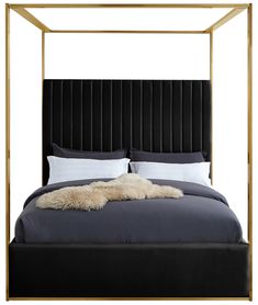 a large bed with a metal frame and pillows on it's headboard, in front of a white background