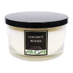 a jar of coconut woods candle on a white background