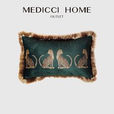 a green pillow with leopards on it and the words medicoi home outlet