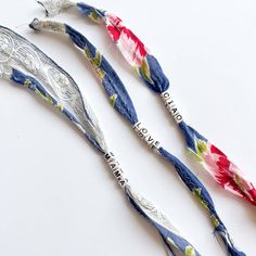 three spoons with floral designs on them sitting next to each other