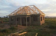 a house being built in the middle of nowhere with a roof that is falling off