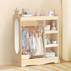 a child's closet with clothes and toys on it in front of a mirror