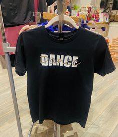 Dance t-shirt . Adult sizes. Bespoke design created by me. Luxury quality 100% soft ringspun cotton tee . Dance teacher gift  Great for wearing to the studio, warming up, or casual with friends.  This is a quality tee in sizes adult ladies XS - XL.  The cotton is combed and ring-spun to give the ultimate softness and comfort. Having side seams it keeps its shape better than other brands . Finished with  twin needle sleeves and hem.  The design was created by me, so you won't find it elsewhere . Dance T Shirt, Dance Teacher Gifts, Dance Gifts, Dance Teacher, Warming Up, Bespoke Design, Teacher Gift, The Studio, Clothing Items