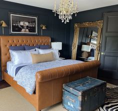 A classic bedroom with dark walls, a gold chandelier, an English leather tufted queen-sized bed and a three-panel black door. Luxurious Bathtubs, Dark Doors, Hollow Core Doors, Classic Bedroom, Solid Core, Unique Beds, Home Center