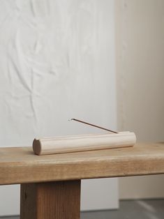 a piece of wood sitting on top of a wooden table