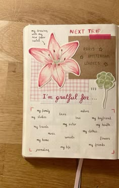 an open notebook with writing on it and a flower in the middle that says next tip