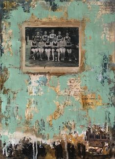 an old wall with peeling paint and some pictures on it