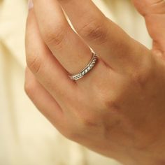 a woman's hand with a ring on it