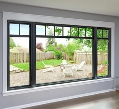 an empty living room with sliding glass doors