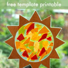 the sun craft is made out of paper and has colorful pieces of glass on it