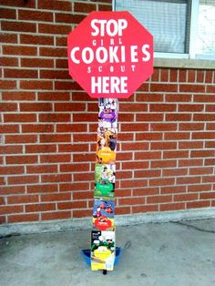 a stop sign made out of cookies on the side of a building with a street sign attached to it