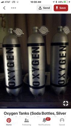 three oxygen cylinders with the words oxygen oxygen written on them are sitting on a table