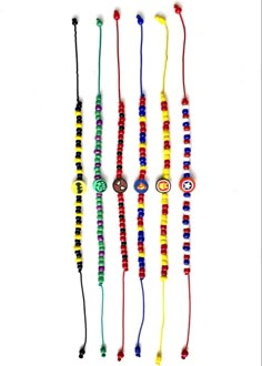 several different colored beads hanging from strings