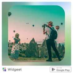 a man and woman are standing in front of hot air balloons with the caption widget