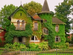 an old house covered in vines and ivys