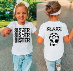 This cute Custom Soccer Sister Shirt is the cutest shirt to support her brother during his soccer season games! This shirt Features brother's soccer name and number on the back of her shirt, with Sister on the front with the soccer look. This Little kid Sister soccer game shirt will sure to make her brother smile in support of her Big Brother soccer Shirt. These Toddler Girl soccer Sibling Tee comes in a variety of sizes and colors to show off her soccer Sis Shirt to her brother and the crowd! ║ Sporty Personalized Short Sleeve Top, Personalized Short Sleeve Tops For Sports Events, Personalized White Tops For Game Day, White Personalized Team Spirit Top, Sporty Personalized White Top, White Personalized Sporty Top, Personalized White Sporty T-shirt, Sibling Sports Shirts, Toddler Soccer Outfit