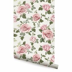 pink roses on white wallpaper with green leaves