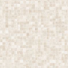 a white tile wall that has been made up of small squares and is very light beige