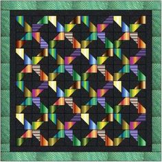 a colorful quilt with many different colors on it