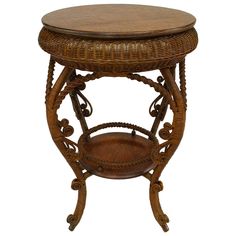 an old wooden table with wicker on the top and round wood shelf at the bottom