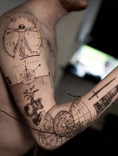 a man's arm with some drawings on it