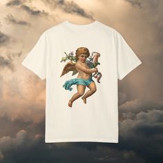 Elevate your wardrobe with our Cherub Baby Angel Garment-Dyed T-shirt, a celestial-inspired garment that brings a touch of heavenly charm to your everyday style. Crafted from premium quality cotton and meticulously garment-dyed for a soft, lived-in feel, this tee offers both comfort and vintage appeal. Featuring a delightful cherub baby angel design, this t-shirt embodies innocence and whimsy, adding a touch of ethereal beauty to your look. Whether you're dressing up for a casual outing or lounging at home, this tee is a versatile addition to any wardrobe. The garment-dyed process ensures each shirt has its own unique character, with subtle variations in color and texture that enhance its vintage aesthetic. With its relaxed fit and breathable fabric, this t-shirt is perfect for layering or Cherub Baby, Baby Angel, Ethereal Beauty, Vintage Aesthetic, Mode Vintage, Dye T Shirt, Shirt Price, Breathable Fabric, Everyday Fashion