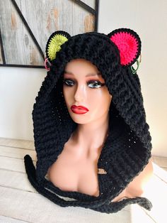 a mannequin wearing a knitted hat with ears