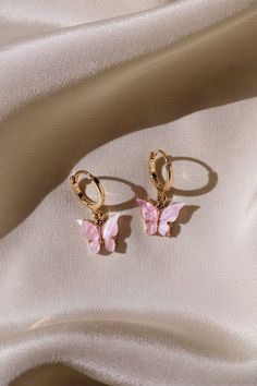 * 18 kt Gold Plated Pastel Butterflies * 14 kt Gold Filled Huggie Hoops Dainty, Simple, & Beautiful 18 kt Gold 3D Pastel Pink Butterflies on 14 kt Gold filled Huggie Hoops that are great for those with sensitive ears. These are super cute! They make a great gift for others or even for yourself. They are simple, dainty, and feminine. I also make these lovely butterfly hoop earrings with Sterling Hoops. Please choose which you would like from the drop down menu. * * What is gold filled? It is a very specialized process which involves fusing a layer of solid 14 kt Gold to brass through high heat and pressure. The bond that is created is a permanent one. The outer layer is solid gold and it is for this reason, 14 kt gold filled will wear like real gold and will remain bright and shiny. These s Bar Stud Earrings, Girly Jewelry, Butterfly Earrings, Gold Plated Earrings, Ear Jewelry, Huggies Earrings, Cute Jewelry, Skater Dress, Jewelry Ideas