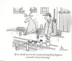 a man sitting at a table with a deer in front of him talking to another man