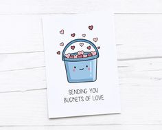 a greeting card featuring a blue bucket filled with hearts and the words sending you bloopets of love