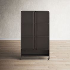 a brown cabinet sitting on top of a hard wood floor next to a white wall