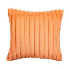 an orange pillow on a white background