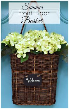 a wicker basket with flowers and welcome sign